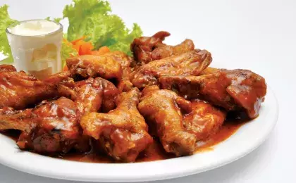 Куриные крылья в морковном соусе